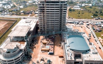 Under Construction - rear view of site showing carpark to left and power plant to right (megastarng.com)