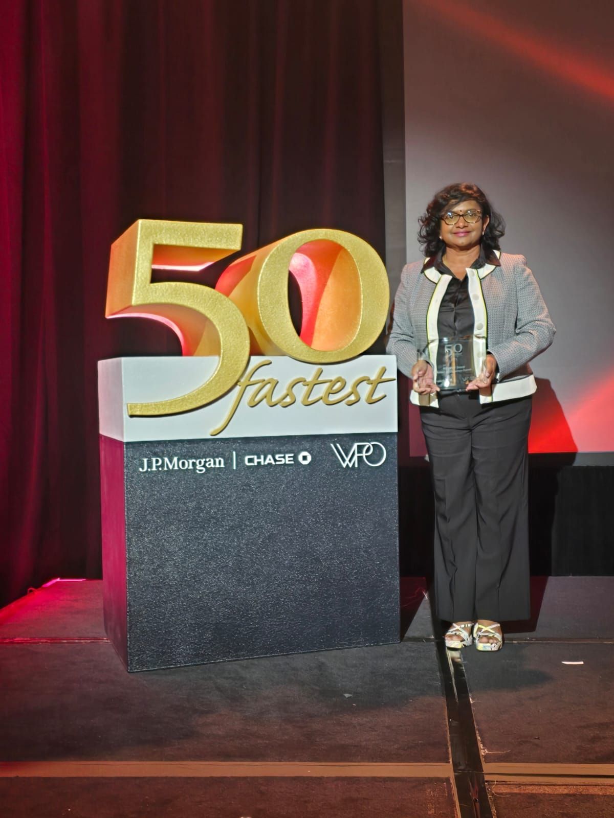 Eng Malani Padayachee-Saman accepting MPAMOT's award for being one of the top 50 fastest-growing women-owned and led organisations worldwide Source: WPO