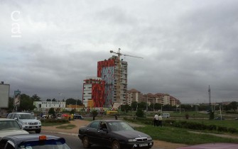 Red Kente-patterned facade installation on the 17 storey Azure Tower (livinspaces.net)