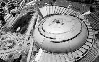 Aerial view of conference centre dome construction, with facade installation in progress (chinadaily.com.cn)