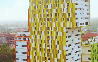 Side view of completed 30 storey Alto Tower with Yellow Kente-patterned facade (trasaccogroup.com)