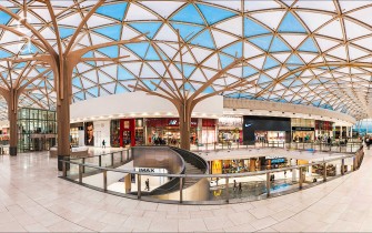 Mall interior showing roof cladding panels and roof support structures (novumstructures.com)