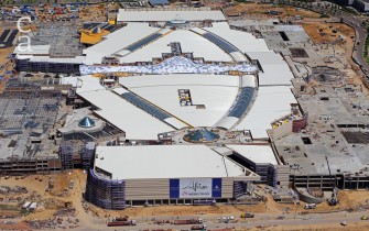 Aerial view of construction showing front of mall, roof in place and car park structures at left & right (Grant Duncan Smith | Dreamstime)