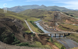 View of the construction site dwarfed by the majesty of the landscape.